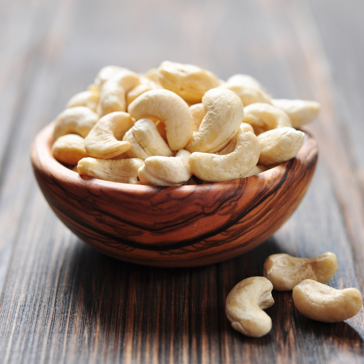 Premium Indian cashews arranged in a bowl